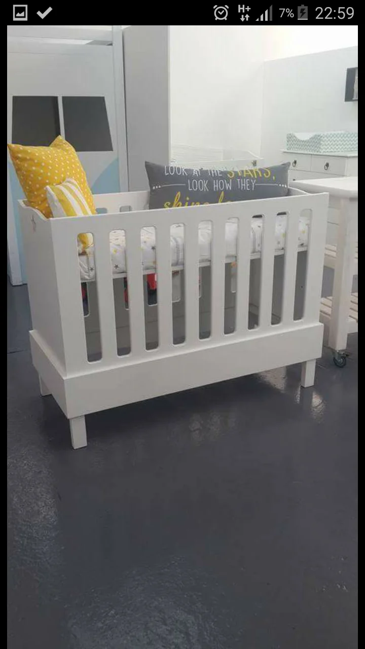 Mika Cot with White Slatted Sides and a Minimalist Design, Available in Standard or Large Sizes